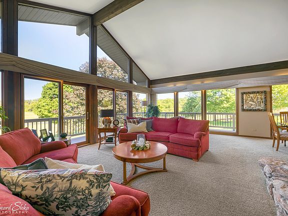 WALL OF WINDOWS AND VAULTED CEILINGS