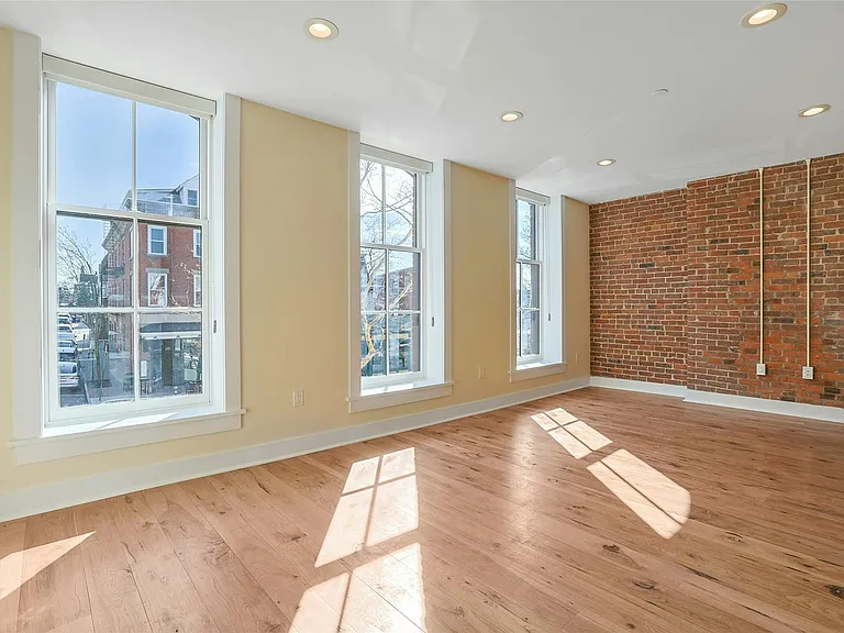 Living Room: As you enter, you're greeted with a light-filled living space.