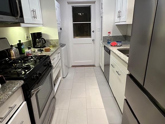 kitchen with w/d unit next to back door