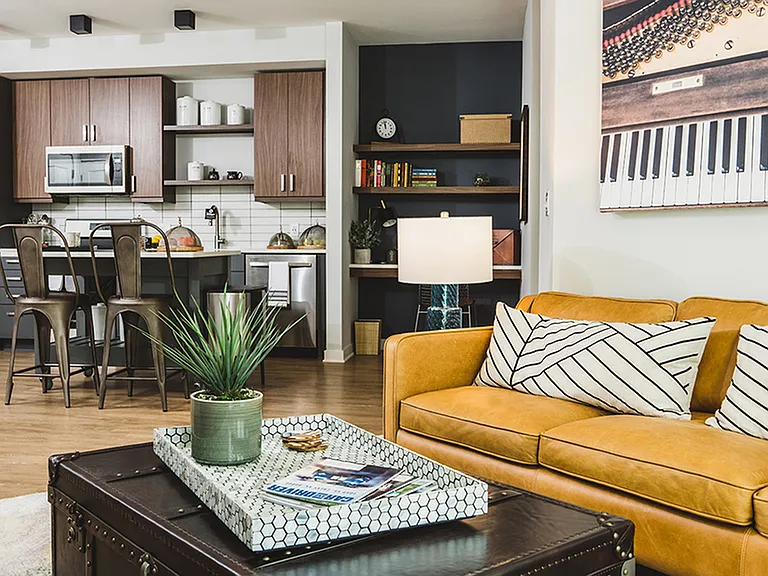 Gorgeous apartment homes with two-toned cabinetry, stainless steel appliances, and built-in work from home desk