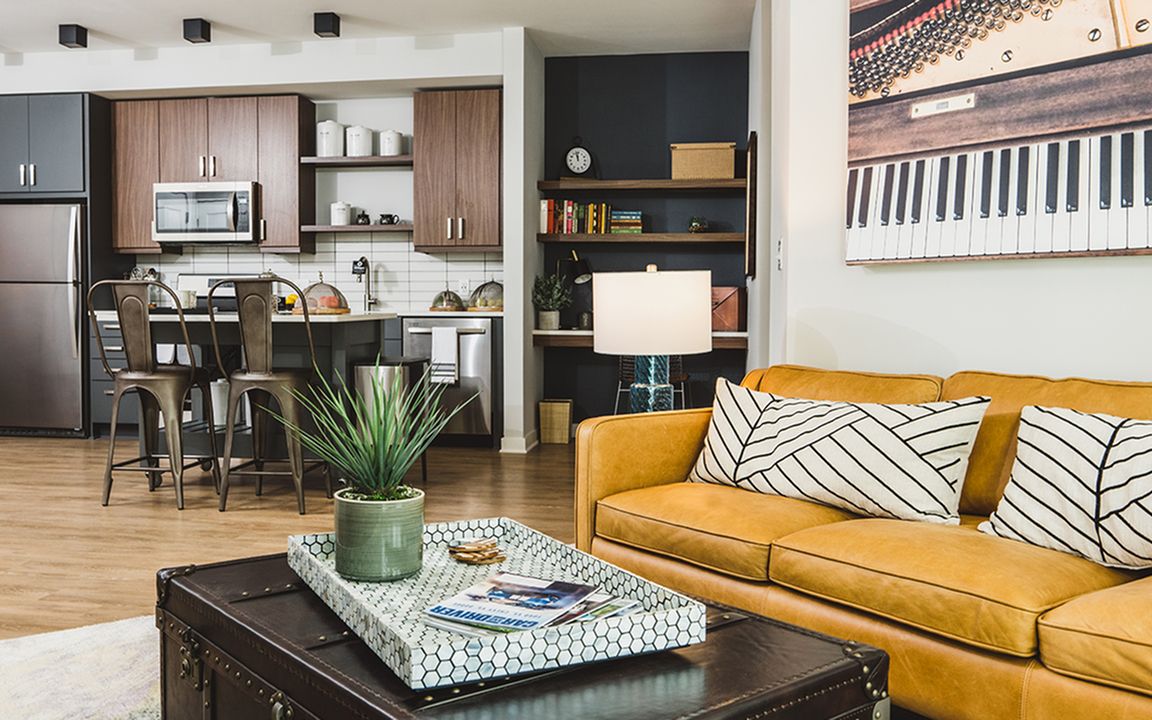 Gorgeous apartment homes with two-toned cabinetry, stainless steel appliances, and built-in work from home desk