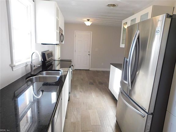 Stainless steel appliances all approximately 3 years old. Floors throughout the house are beautiful ceramic tile.