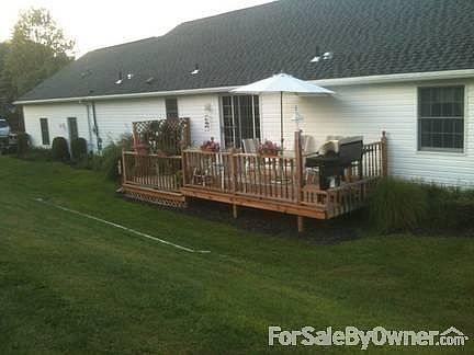 back deck
						:
						ample space for sunset grilling and entertaining in this quiet neighborhood