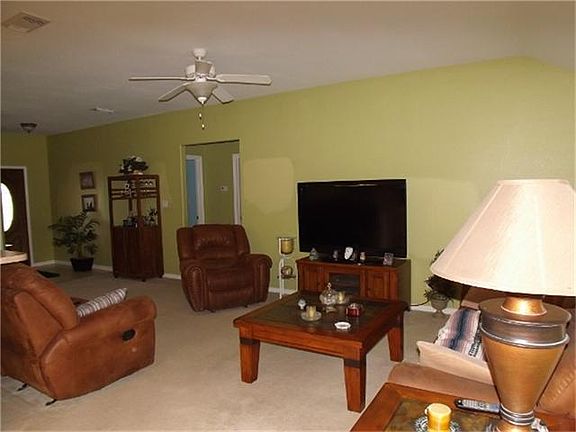 Family room with high ceilings and open concept.
