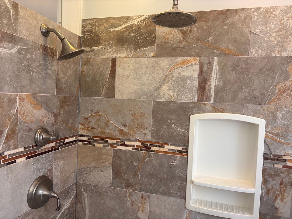bathroom with 2 shower heads
