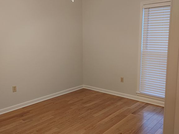 One of the secondary bedrooms freshly painted new hardwood floors
