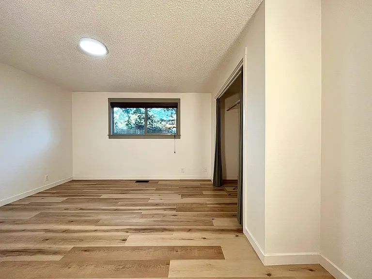 Master bedroom with view to the private backyard.