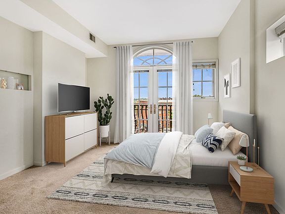 Bedroom with balcony (virtually staged)