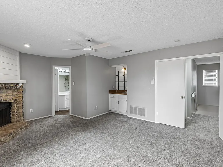 Primary Bedroom with Fireplace and Wet Bar