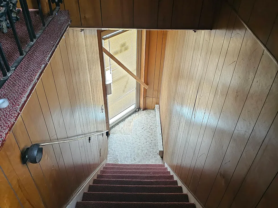 Private entrance/stairs leading up to the unit