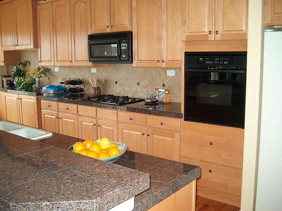Kitchen with Granite Tile Countertop