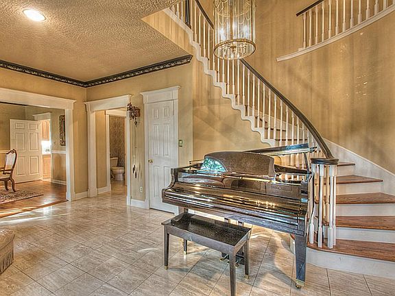 Elegance and style await your guests. This grand winding staircase creates a dramatic entry.