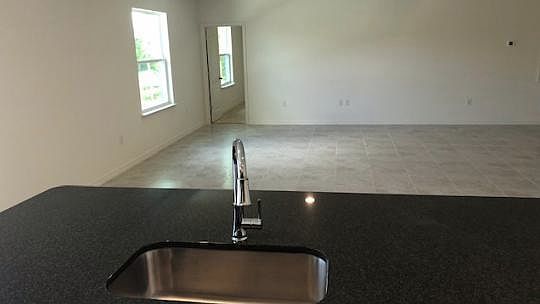 Awesome island overlooking the great room gives this home a