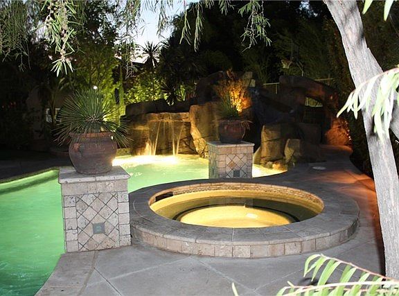 Waterfall, slide, lights, spa, and heat are all controlled with a remote.