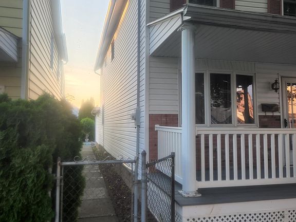 Side of house walkway to the rear entrance and back yard