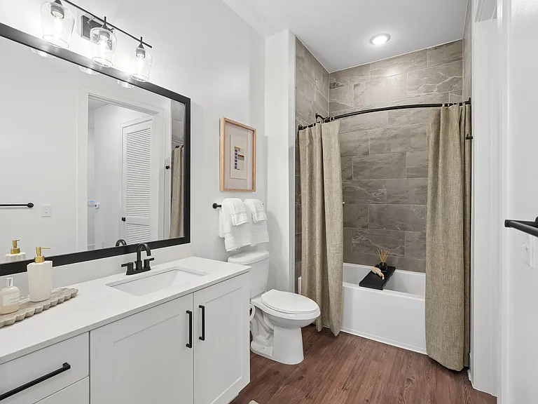 Bathroom with Quartz Countertop and Soaking Tub