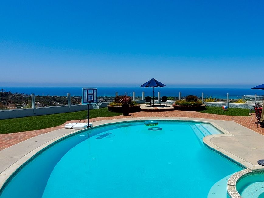 Welcome to our beautiful Ocean View home with heated pool, jacuzzi, firepit, bbq and lots of outdoor seating & sunbathing.