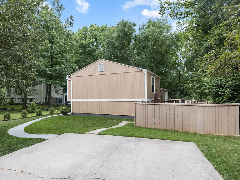 2 car driveway with access to front door and back patio