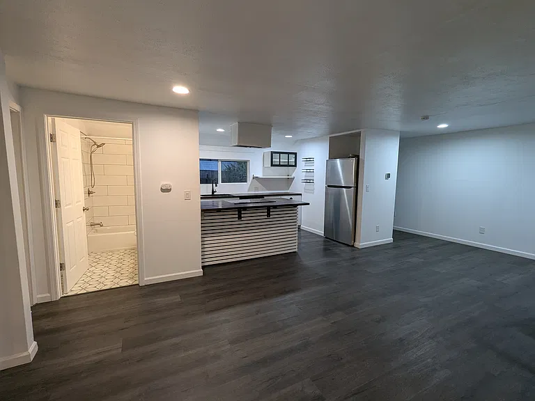As soon as you enter, into wide open living, dining, kitchen space.