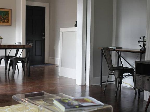 Living room room looking at dining room and front door