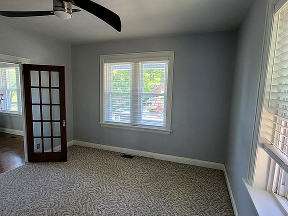 2nd bedroom or office space. Updated remote controlled ceiling fan, french doors with privacy shades, updated min-blinds, and lots of natural light!