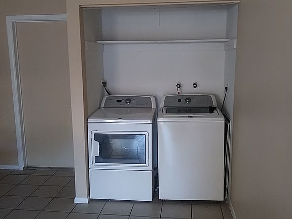 Laundry closet and machines.