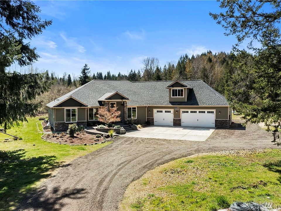 Custom home on 5+ Acres is truly One-of-Kind. Ideal Communal living opportunities.