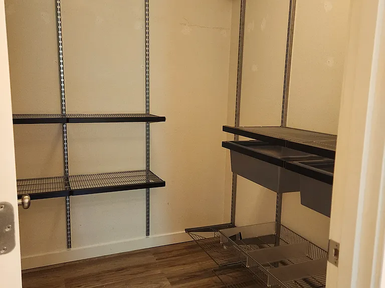 Walk in closet with Elfa storage system