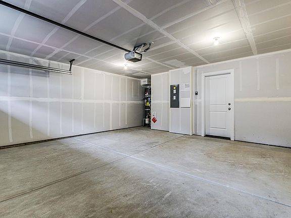 Large 2 car side by side garage with driveway