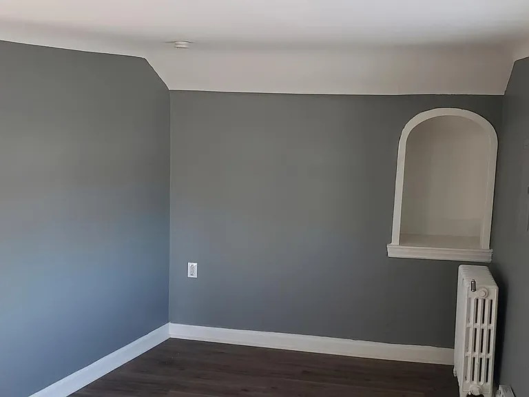 Living room with storage alcove.