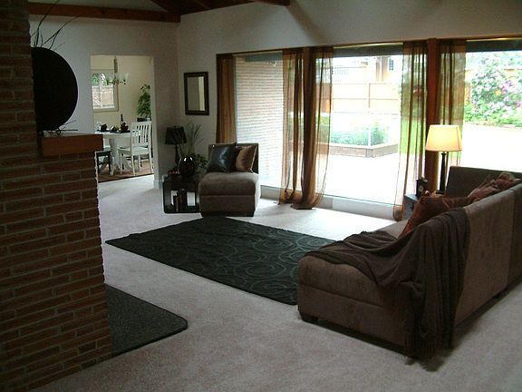 Living room with vaulted ceilings and fireplace