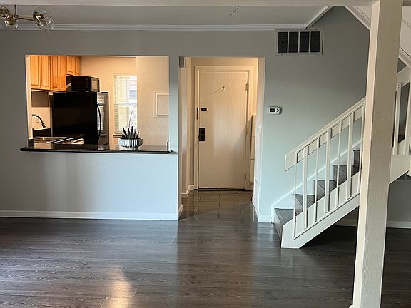 View of front door kitchen and dining space from living room