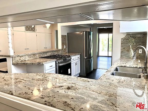 Spacious kitchen with stone top and lots of closet / storage space