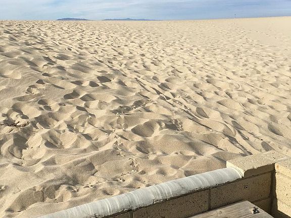Your patio steps onto the sand