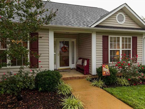 Covered front entry, locable fullview glass storm door