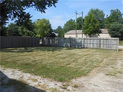 Back yard with privacy fence surrounding the back of the property, access to rear from the alley.