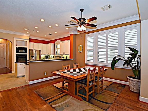 Dining area between the living room and kitchen is open and spacious. Lots of natural light in this home.