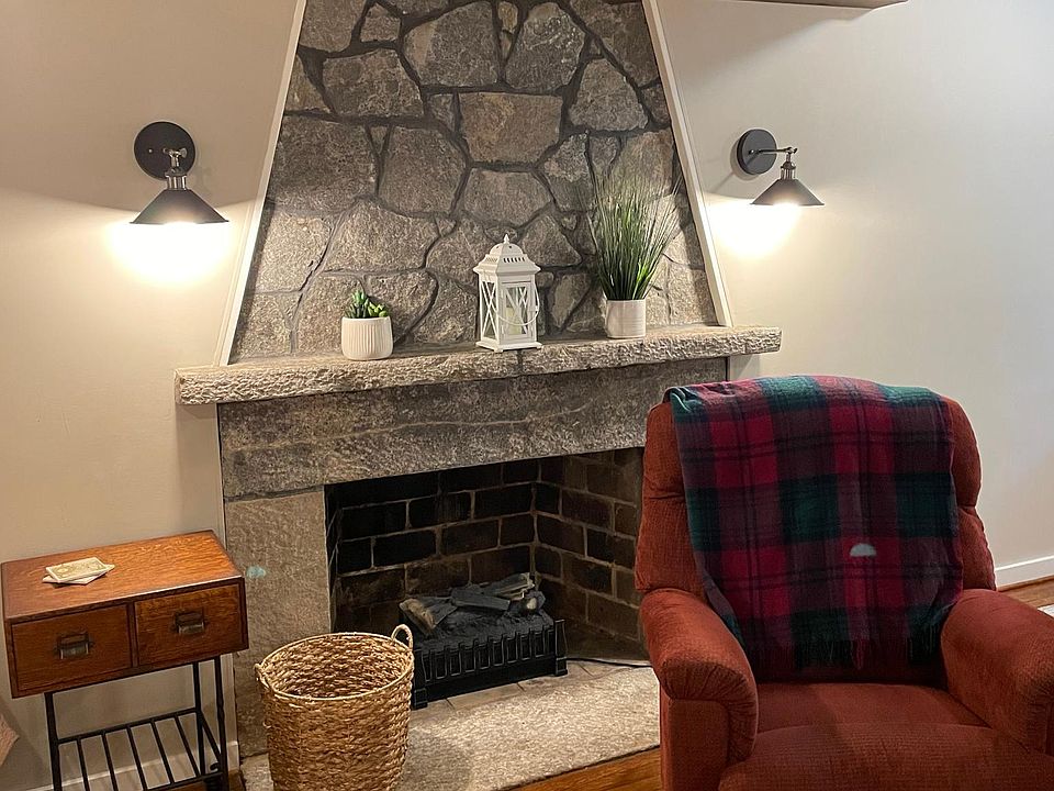 Fireplace, comfy chair.