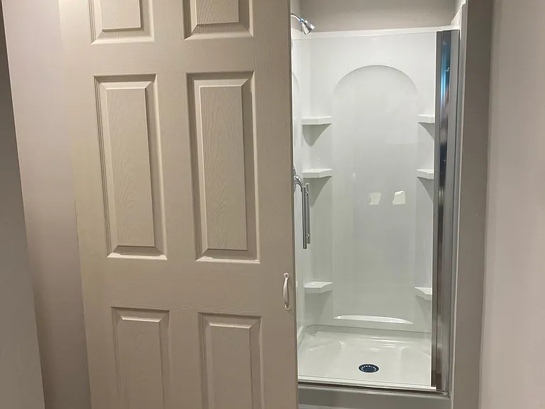 Photo taken from hall, slider door to bathroom