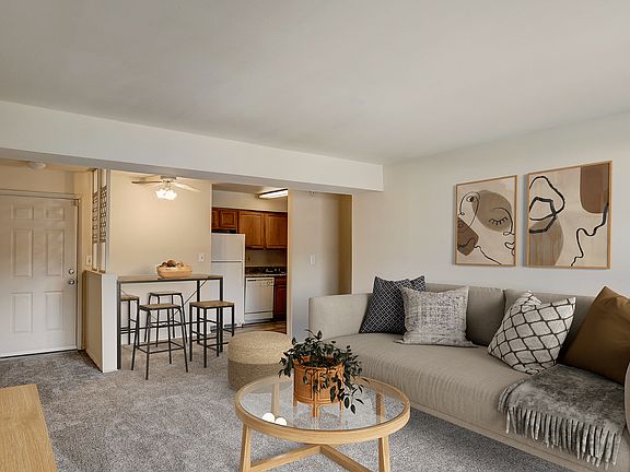 Experience the warmth and style of this delightful living space with its seamless kitchen integration.