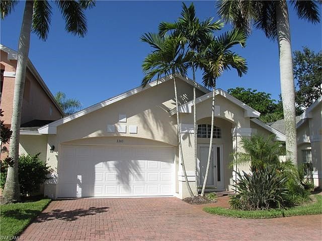 Pavered driveway and two car garage