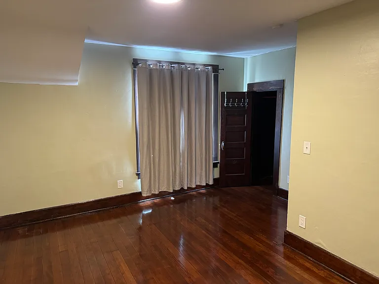 This bedroom is large and has a window on the front of the home and side of the home for great light!