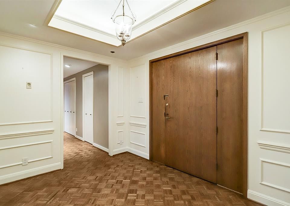 Entry hall showing hardwoods, millwork and cove lighting.