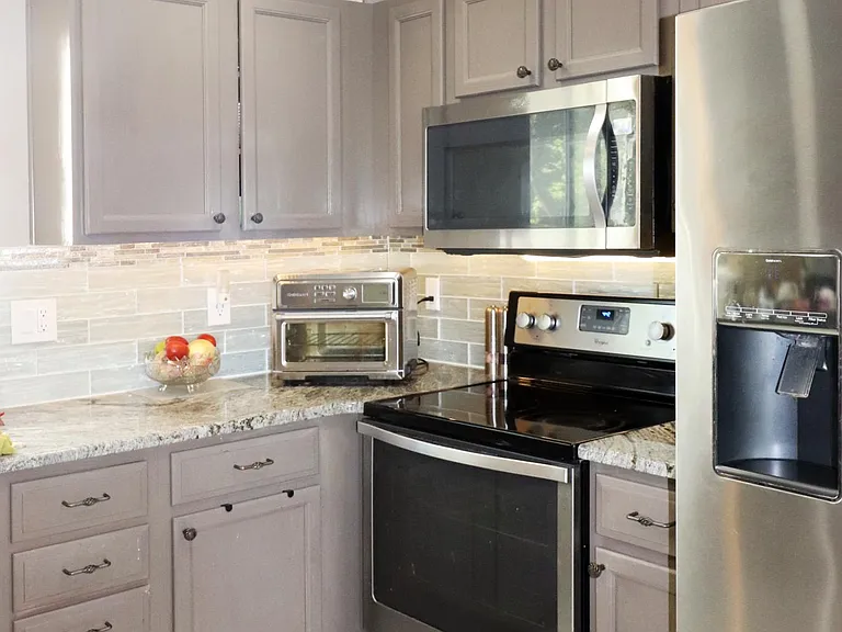 Granite countertop with tile backsplash