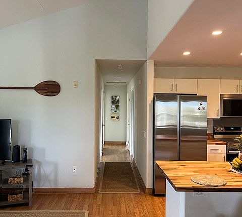 Vaulted ceilings enhance the open, airy ambiance while adding a touch of elegant architectural detail