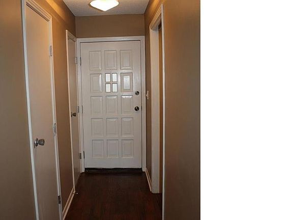 Entry hall has a half bath, a coat closet and a utility closet