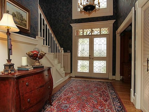 Step inside onto hand sanded solid wood floors that run thro