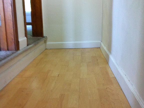 Hallway with entries to two bedrooms on third floor
