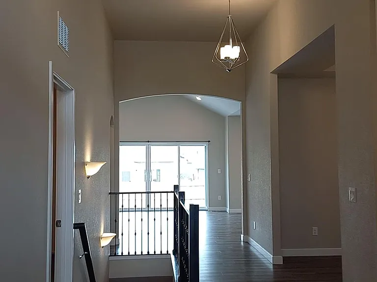 Looking thru the breezeway from thr front door to the back patio door.