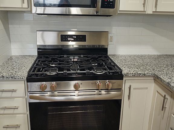 New stove and microwave, dishwasher, refrigerator and granite countertops
